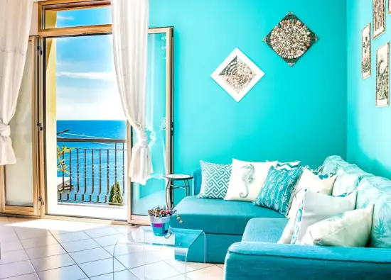 BOHO apartment living room with sea view at Cohen House Taormina